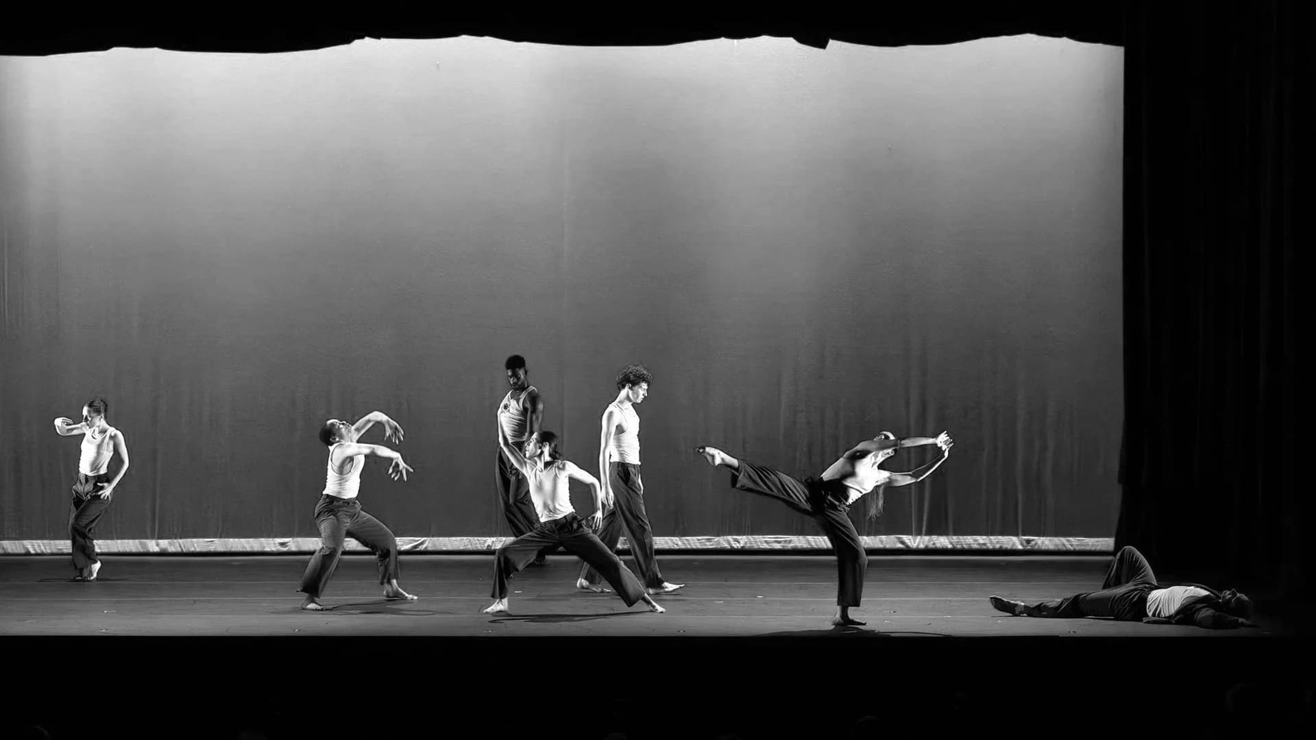 DMD dancers performing together on stage at the Detroit Institute of Arts